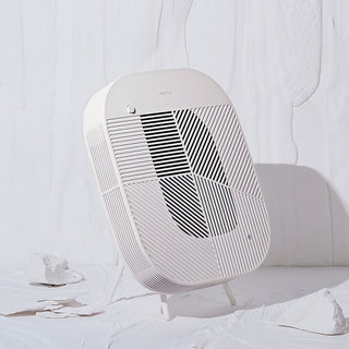 Modern white air purifier on a white background