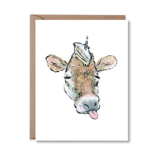 Greeting card with a cow illustration wearing a cake hat on a white background