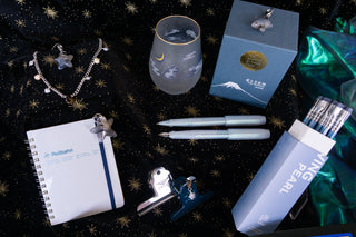 Iridescent pearl fountain pen with silver clip and cap; light blue translucent barrel