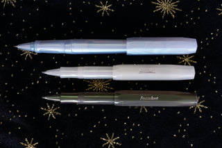 Three kaweco pens on a black fabric star background