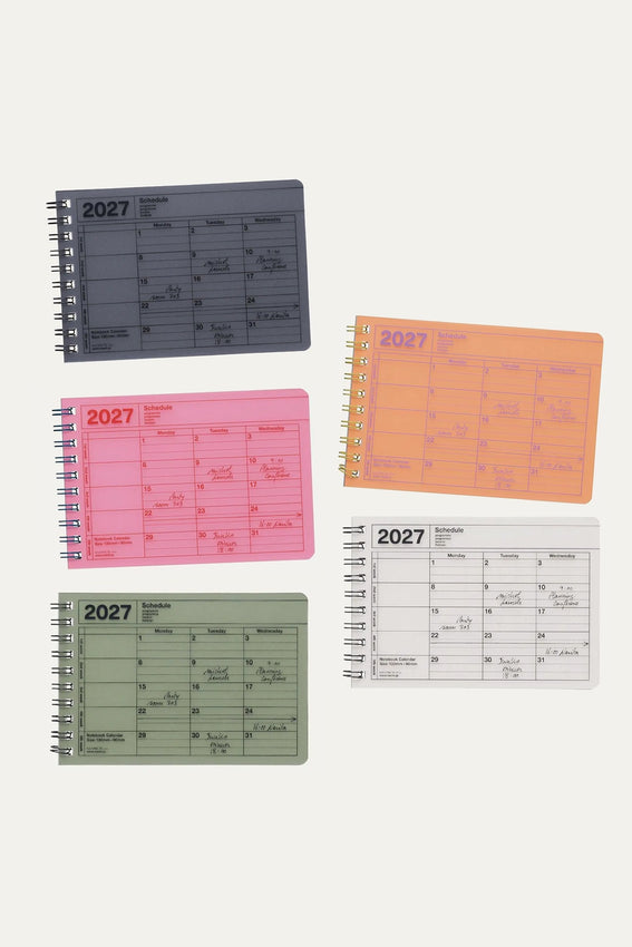 2027 notebook calendar set with multiple small covers in dark, pink, green, and orange