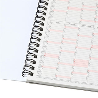 Spiral-bound planner with a calendar on a white background
