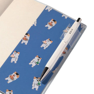 Back cover of planner showing a pen loop with a pen for demonstration. 