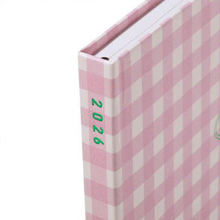 Pink checkered planner with '2026' on a white background