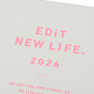 Close up of white planner with 'Edit New Life 2026' pink text on a light background