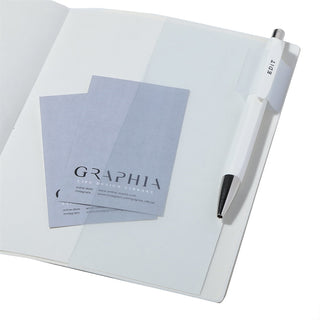 Open planner to demonstrate pen loop holder on a white background