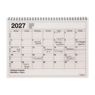 ivory monthly notebook calendar on a light background