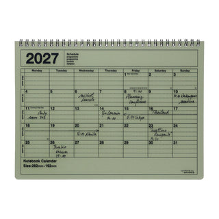 khaki monthly notebook calendar on a light background