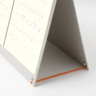 Close up of strings on calendar page on a white background