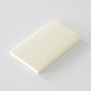 Monthly notebook planner on a light gray background