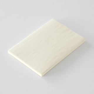 Beige notebook on a light gray background