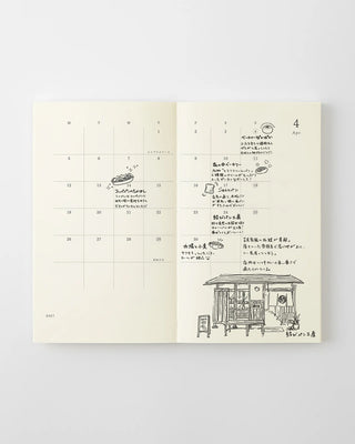 opened notebook calendar with april 2027 spread and doodles and hand writing