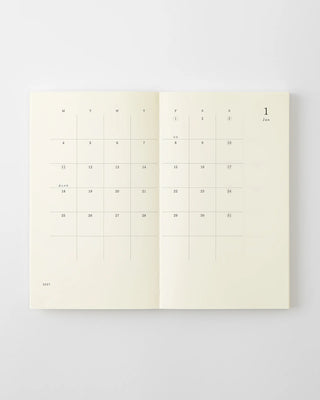 opened notebook calendar with january 2027 spread and minimalist design