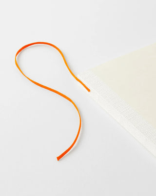 planner with orange ribbon bookmark
