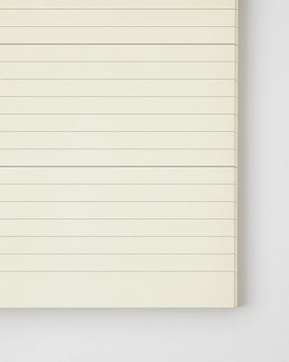 close up of opened notebook with lined pages