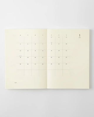 opened notebook calendar with january 2027 spread and minimalist design