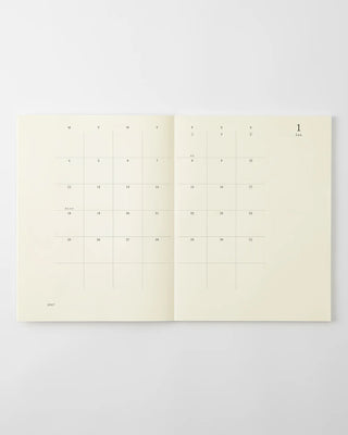 opened notebook calendar with january 2027 spread and minimalist design