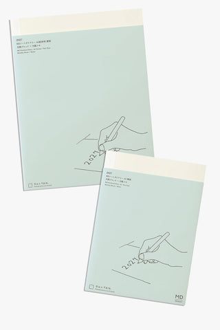 two blue notebooks on a light background, md notebook diary thin type