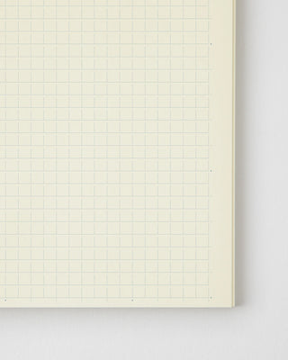 close up of notebook planner with grid pages