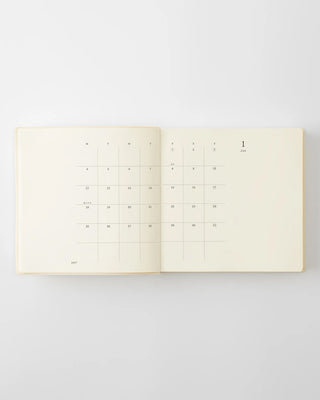 opened notebook calendar with january 2027 spread and minimalist design