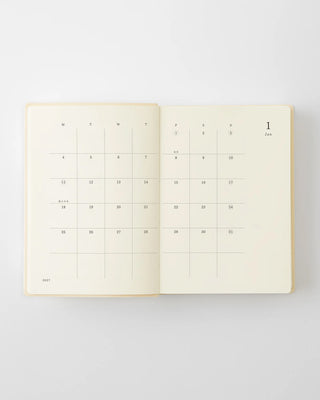 opened notebook calendar with january 2027 spread and minimalist design