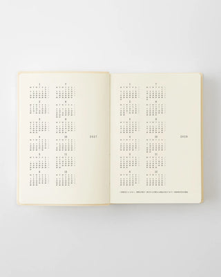 opened notebook calendar with 2027 and 2028 year at a glance pages