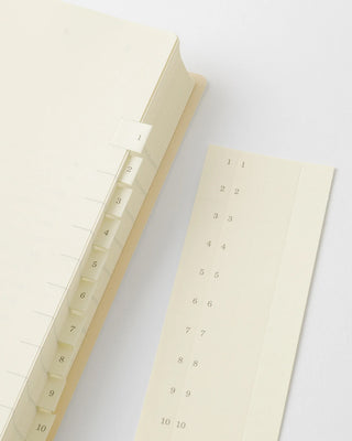 planner with adhesive tabs for monthly pages