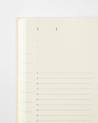 close up of page a day planner with vertical hourly lines
