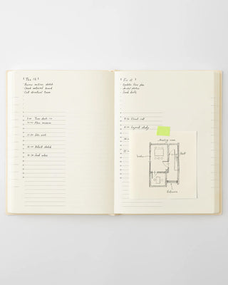page a day planner with vertical hourly lines with handwriting and doodles