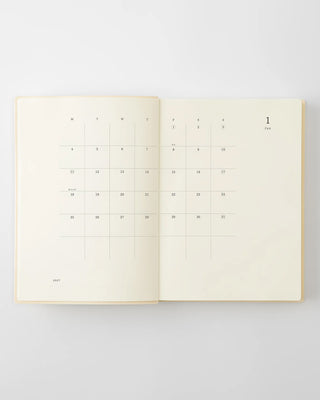 opened notebook calendar with january 2027 spread and minimalist design