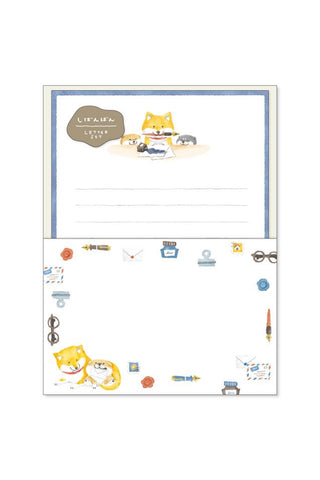 Stationery set with cartoon dog design on a white background