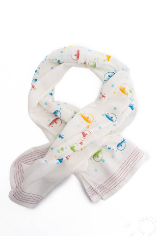 Towel with colorful puffer fish pattern on a white background