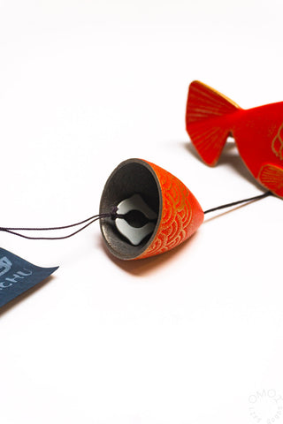 Red fish wind chime bell cap with black interior and hanging cord
