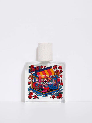 Perfume bottle with colorful label featuring 'Arashi no Umi' and 'Maison Matine' on a white background