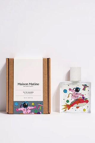 Perfume bottle with colorful design and packaging on a white background