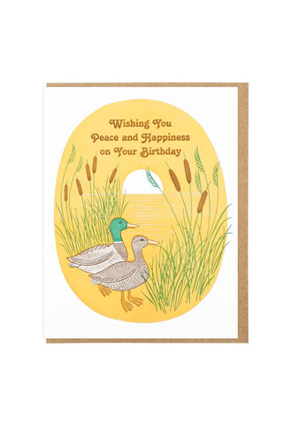greeting card with illustration of two ducks in a yellow oval, with the text 'Wishing You Peace and Happiness on Your Birthday'
