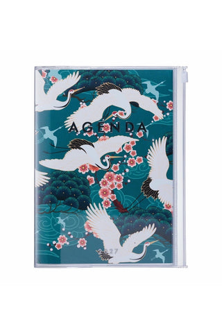 planner with zipper pocket and cover featuring crane birds and flowers on a green background