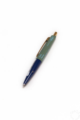 Green and navy Marks pen on a white background