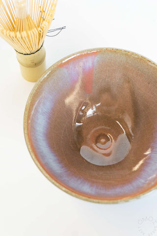 Ceramic bowl with a textured surface on a white background