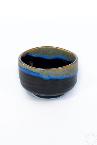 Ceramic chawan bowl with blue interior on a white background