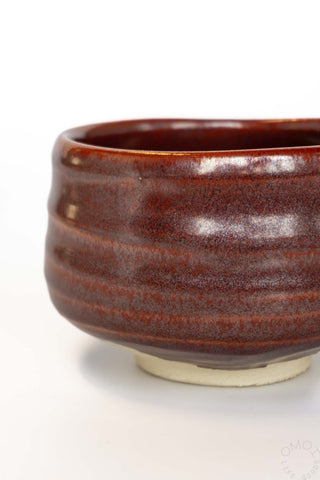 Brown ceramic bowl on a white background