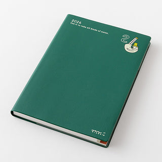 Green notebook with 2026 date on a white background