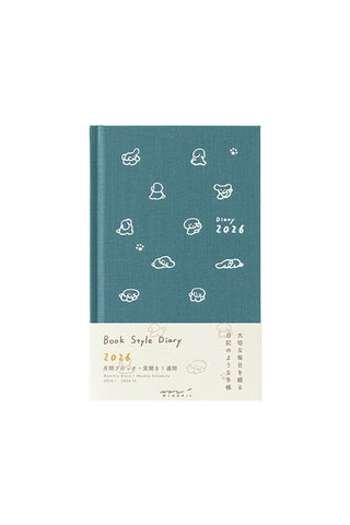 Blue diary with white dog illustrations on a white background