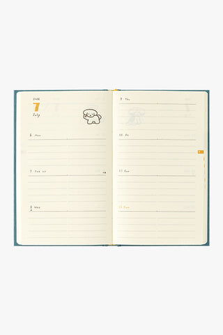 Open planner with lined pages on a white background