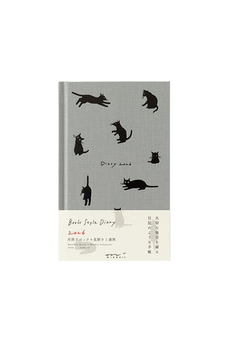 Book cover with black cat illustrations on a gray background