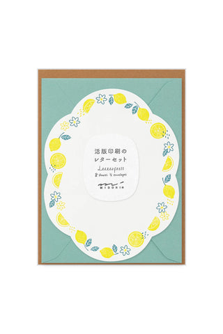 Letter set with lemon design on a green background