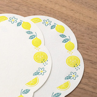 Close up of letter press stationery sheets with lemon design