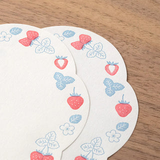 Two sheets of letter press stationery with strawberry design