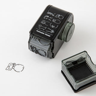 Black paintable rotary dial stamp with engraved character icons and separate ink pad