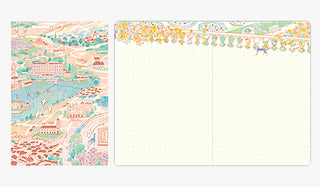 Dot grid notebook with scenic designs on a white background